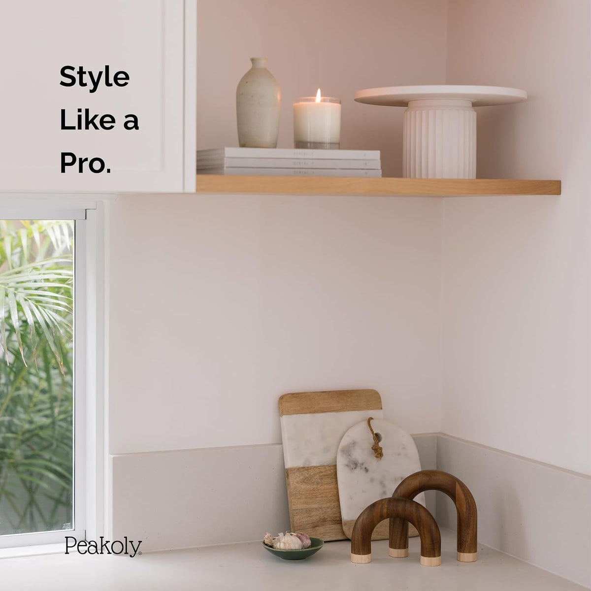 Decorative items on a shelf with 'Style Like a Pro' text and Peakoly branding.