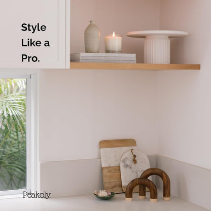 Decorative items on a shelf with 'Style Like a Pro' text and Peakoly branding.