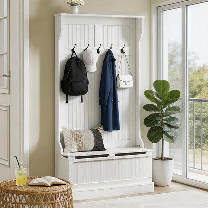 White hall tree with hooks and bench in a room with a plant and table.