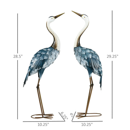 Two decorative heron statues with measurements on a white background