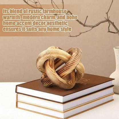 Decorative wooden knot on top of books with a neutral background