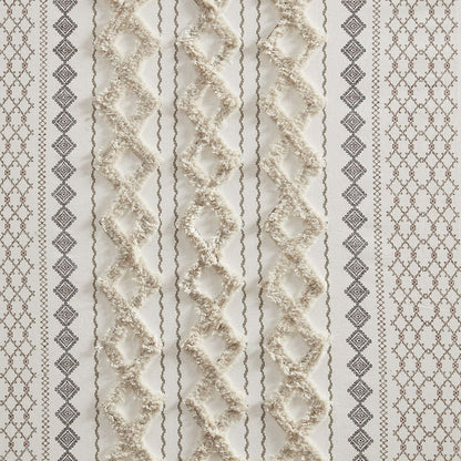 Close-up of the textured geometric pattern and tufted chenille stripe on the ivory Imani cotton curtain panel.