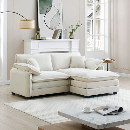 White sectional sofa in a living room with a coffee table and decor items.