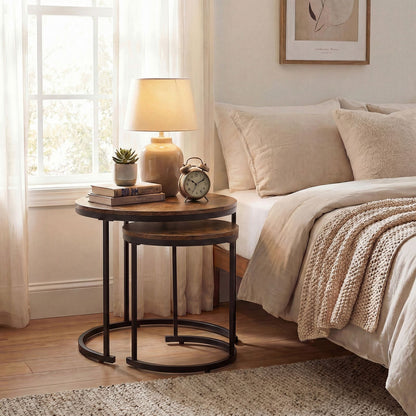 Cozy bedroom with round wooden nightstands, lamp, and alarm clock.