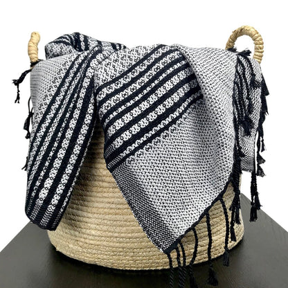 Ethically made bed runner with chevron detailing and hand-tied knots