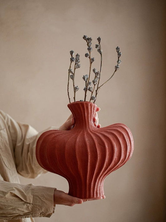 Handmade wabi-sabi vase in brick red for unexpected pop of color