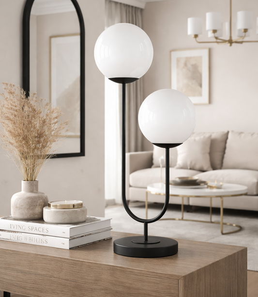 Modern table lamp with spherical glass shades on a wooden console table in a living room.