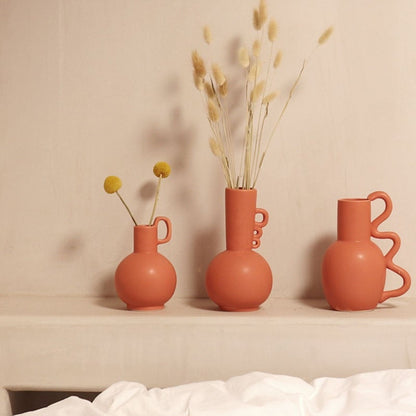Handmade textured neutral vase with round details for floral arrangements