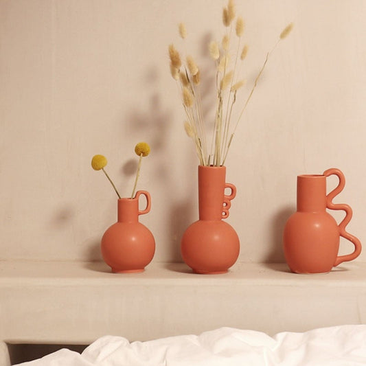 Handmade textured neutral vase with round details for floral arrangements