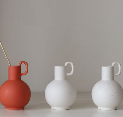 Artisan-crafted ceramic vase with textured surface for stylish interiors