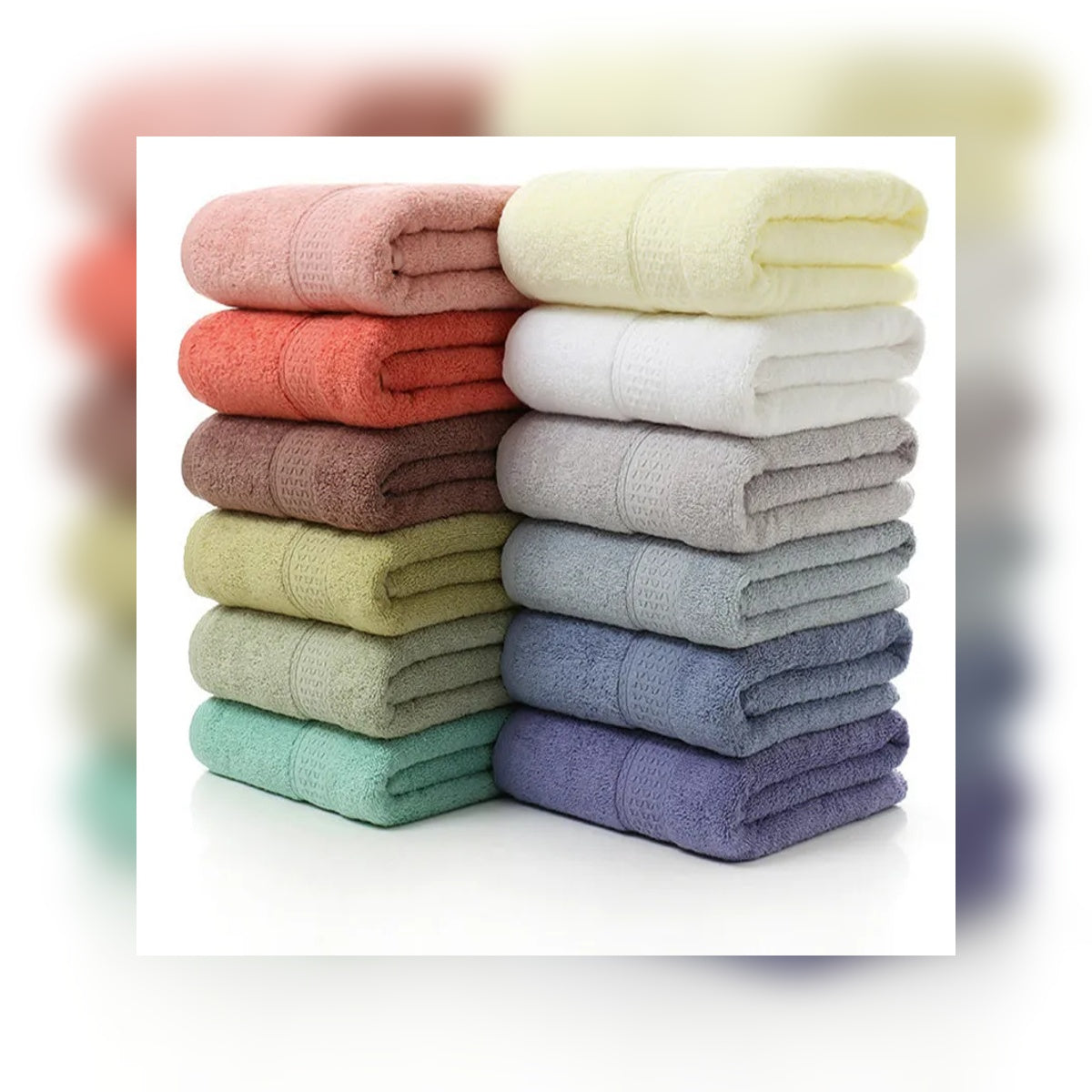 Stack of folded towels in various colors on a white background